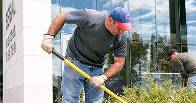 workers outside Segal Visitors Center