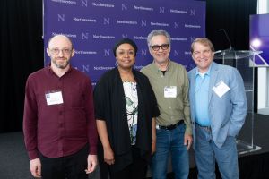 A group of three honorees pose for a group picture.